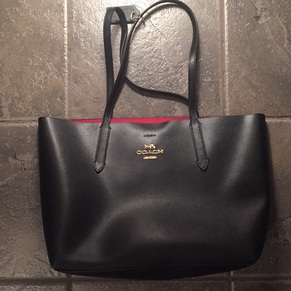 Large navy blue Coach bag with red interior